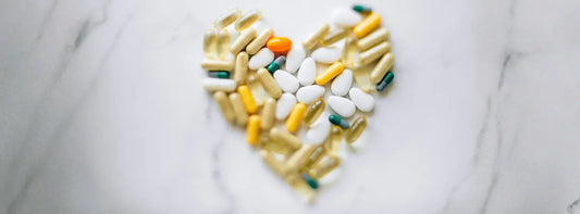 Older adult comparing a lutein eye supplement and multivitamin labels for nutrient overlap