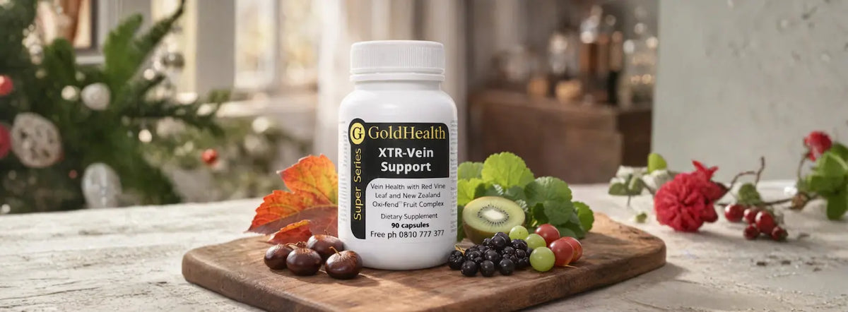 Red and green grapes, sliced kiwifruit, boysenberries and blackcurrants arranged on a New Zealand kitchen table, illustrating the NZ Oxi-fend® fruit complex in Gold Health XTR-Vein Support.