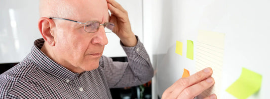 Older New Zealander reviewing a calendar and Bacopa supplement routine for realistic memory-support expectations