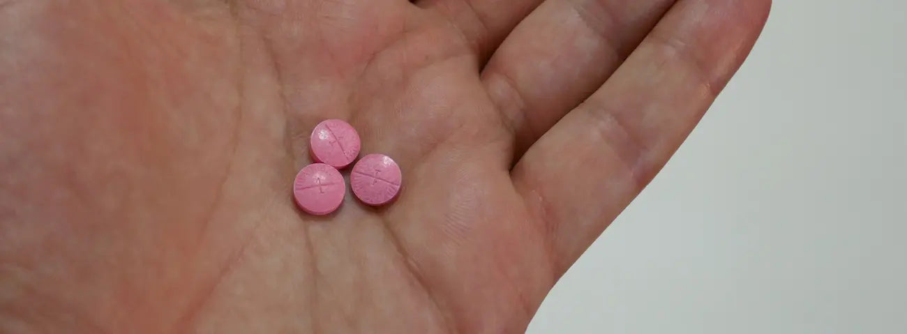 Older adult checking a joint supplement label and medicine list before choosing joint support while taking blood-thinning medicine
