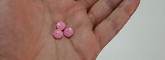 Older adult checking a joint supplement label and medicine list before choosing joint support while taking blood-thinning medicine