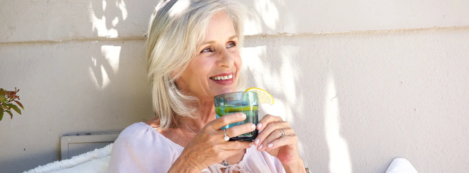 Older New Zealander and adult family member comparing two probiotic labels at a bright kitchen table