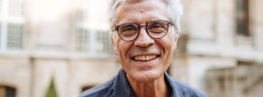 Hero: Older New Zealand adult starting a chewable probiotic routine with a notebook at home.