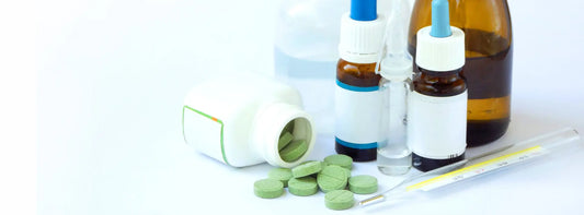 Vitamin B12 capsule bottle, liquid dropper and sublingual option on a kitchen bench for comparing daily routines