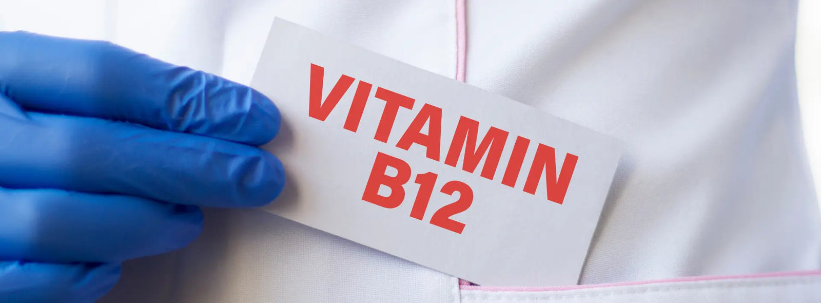 Vitamin B12 price NZ cost-per-day comparison with a supplement bottle, calculator and simple daily cost notes