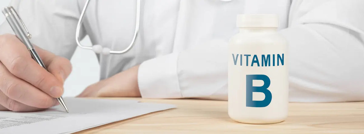 Gold Health B-complex bottle beside a supplement label in a warm New Zealand wellness setting