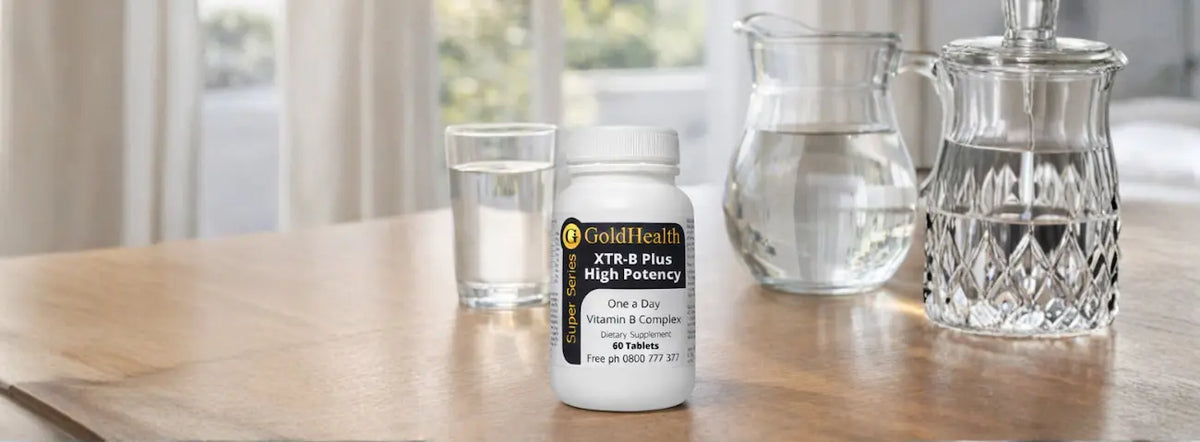 Vitamin B complex tablet beside a meal in a warm New Zealand kitchen, illustrating taking B complex with food