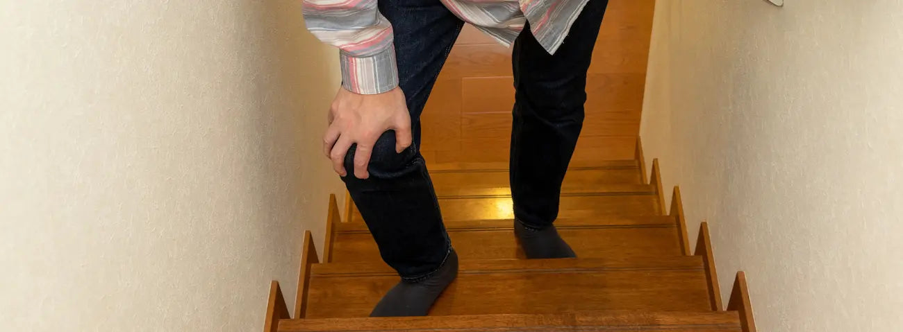 Older New Zealander warming up for a winter morning walk, illustrating joints stiff in cold weather and gentle movement.