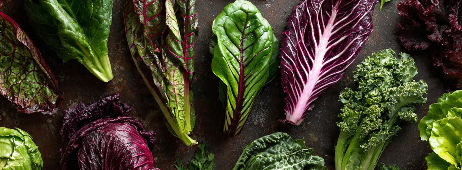 Supplement capsules with leafy greens and fish on a table, suggesting nutrients that support eye health for macular degeneration.