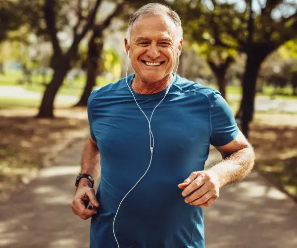 Older couple smiling outdoors, representing Gold Health heart and circulation support