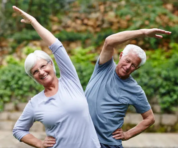 Active senior stretching outdoors, representing Gold Health joint and mobility support